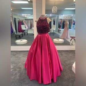 Size 8. fuchsia. beaded. high slit. open back. halter top. pockets